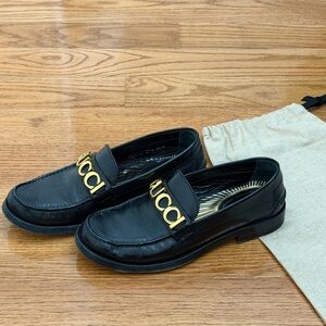 Gucci Black Loafers with Gold Logo